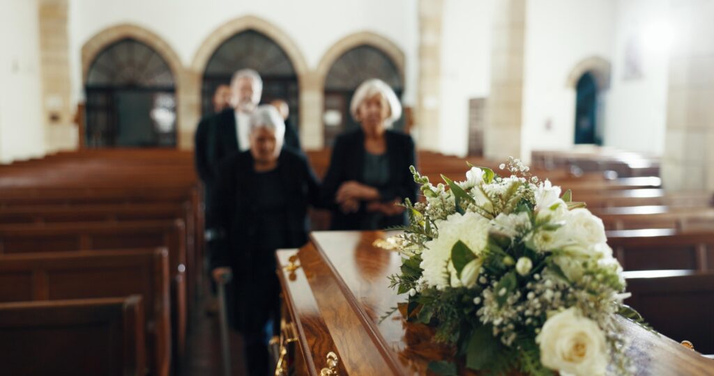 Funeral, church and people with coffin for goodbye, mourning and grief in memorial service. Depress